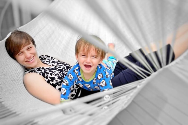 Mum and toddler happy in a hammock